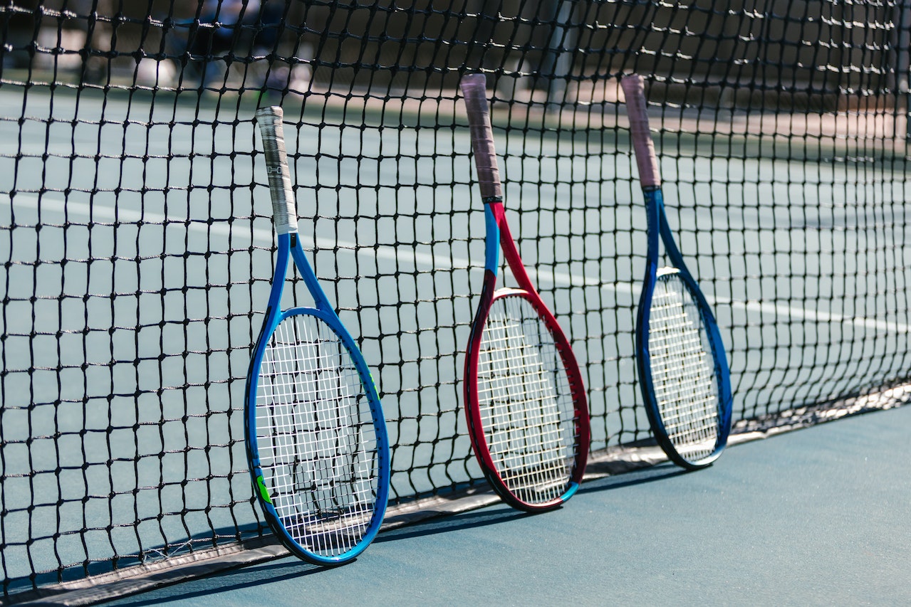 Tennis Rackets on Tennis Net